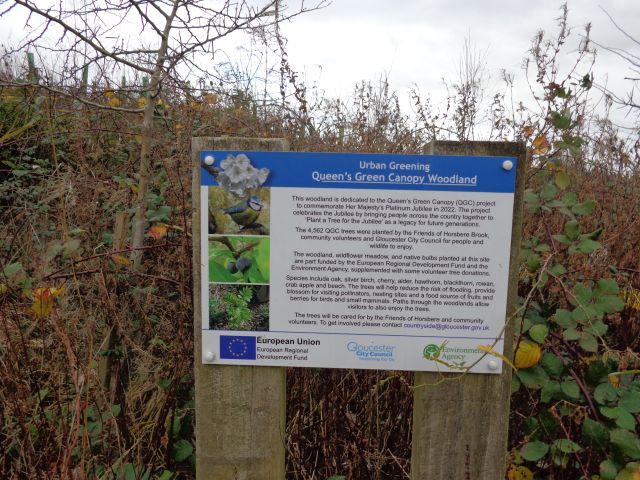 Sign at woodland dedicated to Queen&#039;s Green Canopy.